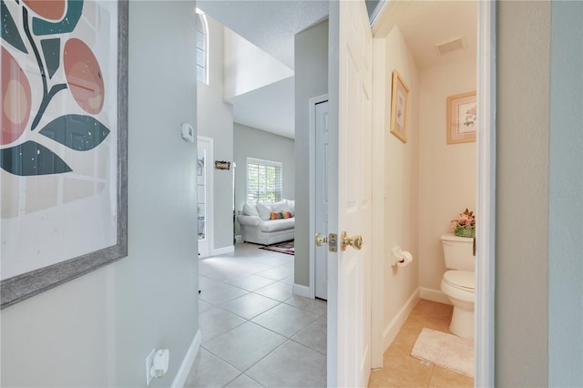 hallway with light tile patterned floors