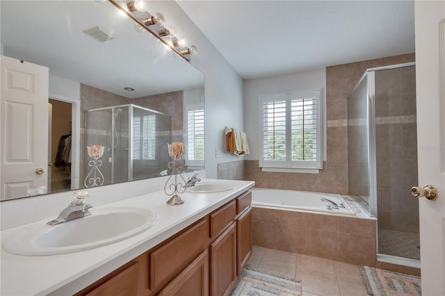 bathroom featuring vanity, plus walk in shower, and tile patterned floors