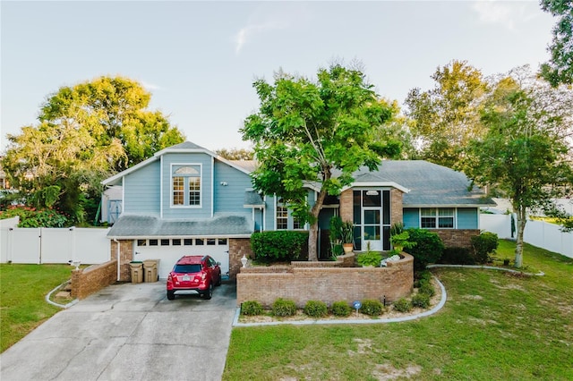 view of front of house with a front lawn and a garage