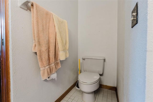 bathroom featuring toilet and tile patterned floors