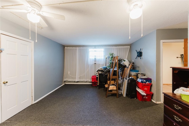 miscellaneous room featuring carpet floors, a textured ceiling, and ceiling fan