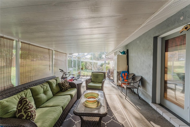 sunroom featuring vaulted ceiling