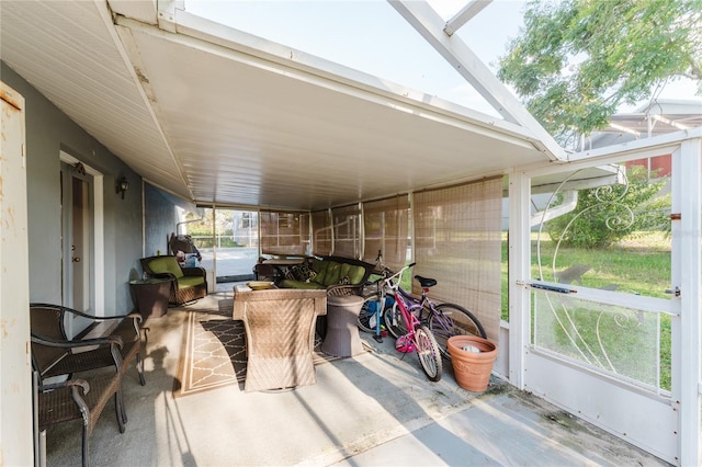 sunroom / solarium with lofted ceiling with skylight