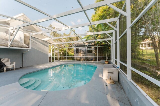 view of pool featuring a lanai and a patio area