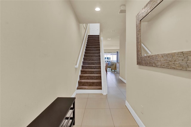 staircase with tile patterned flooring