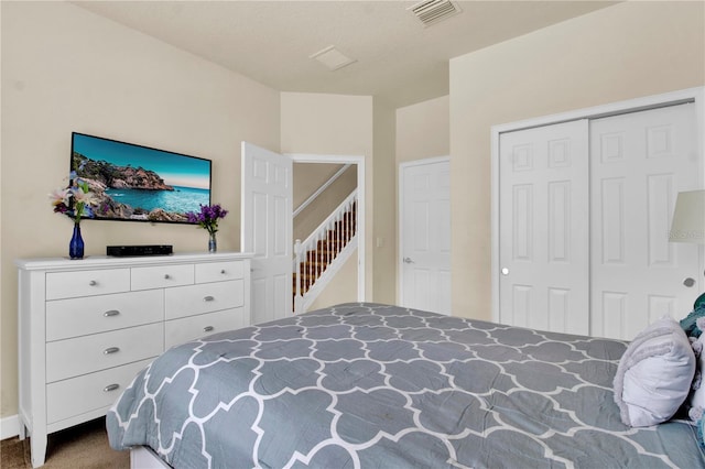 carpeted bedroom with a closet