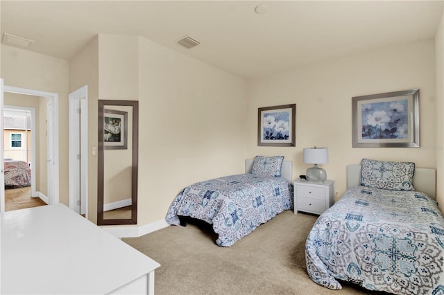 bedroom with light colored carpet