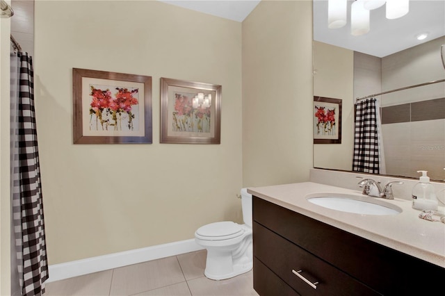 bathroom with tile patterned flooring, curtained shower, vanity, and toilet