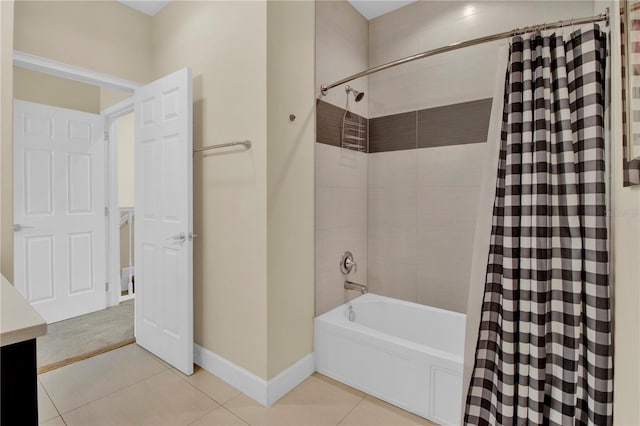 bathroom featuring shower / bathtub combination with curtain and tile patterned floors