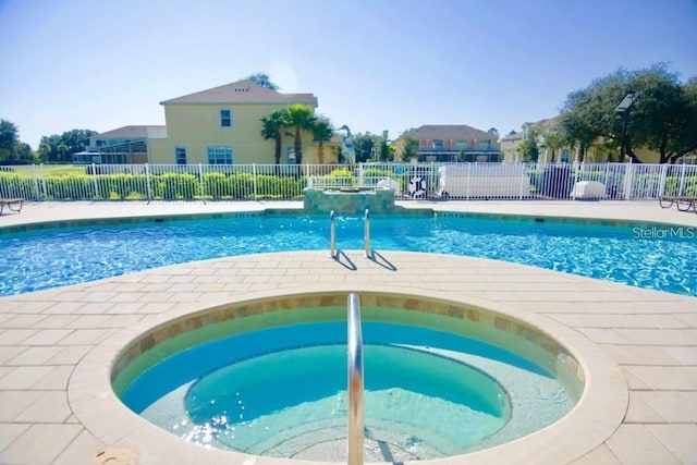 view of pool featuring a hot tub