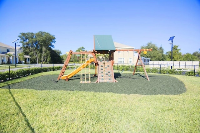 view of playground with a yard