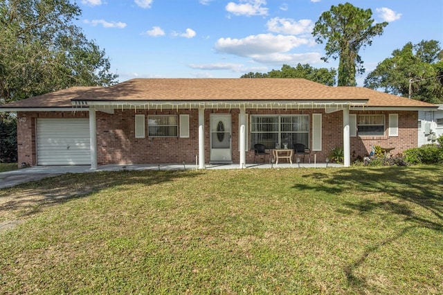 ranch-style house with a garage and a front yard