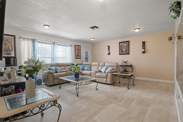 living room featuring a textured ceiling