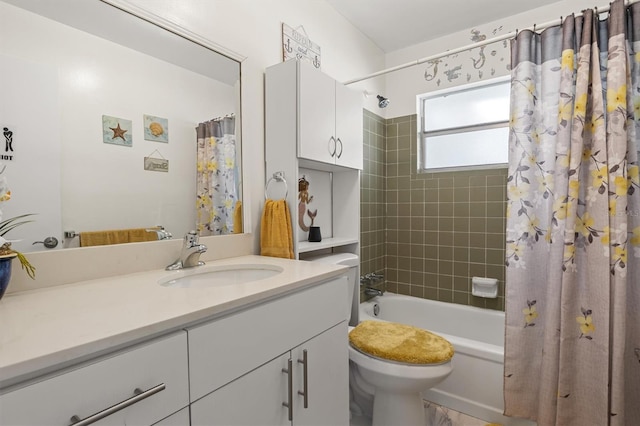 full bathroom featuring shower / bath combo, vanity, and toilet