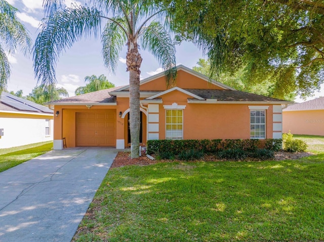 single story home with a garage and a front yard