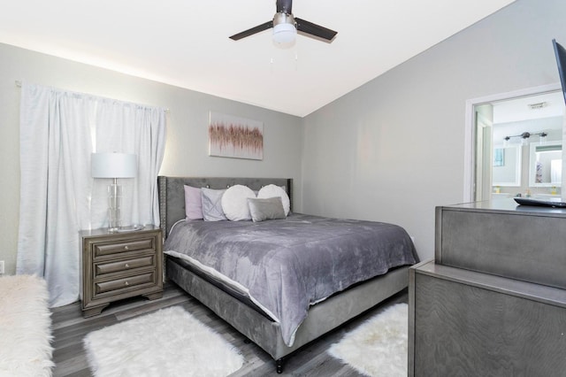 bedroom featuring wood-type flooring, vaulted ceiling, and ceiling fan