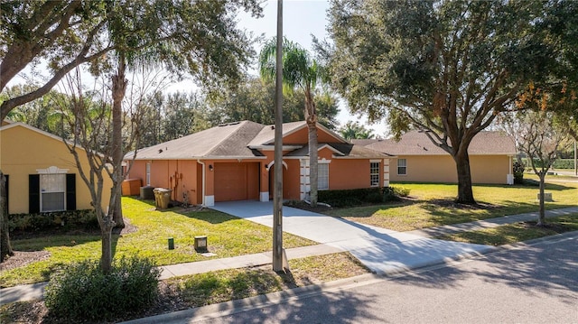 ranch-style house with a garage and a front lawn