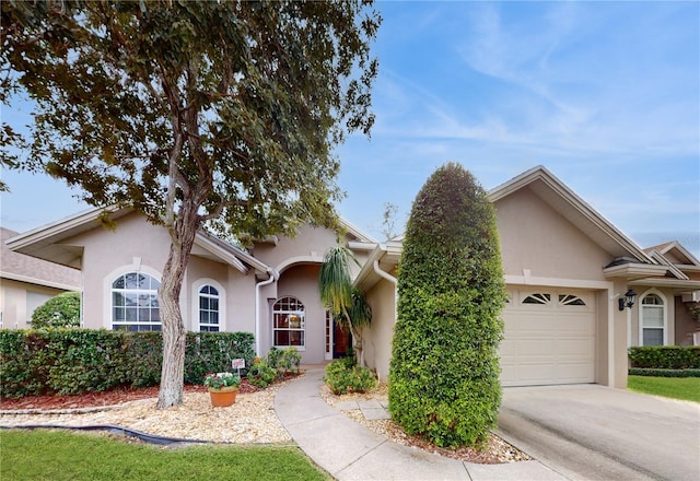 ranch-style home featuring a garage