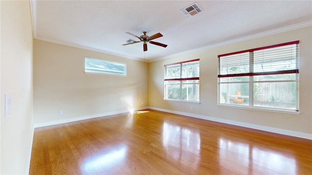 empty room with light hardwood / wood-style floors, crown molding, and ceiling fan