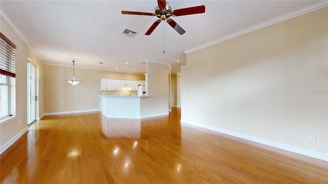 unfurnished living room with light hardwood / wood-style flooring, ornamental molding, and ceiling fan