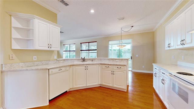 kitchen with white appliances, sink, light wood-type flooring, white cabinetry, and ornamental molding