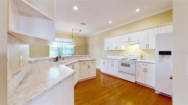 kitchen featuring white cabinetry, sink, pendant lighting, and white appliances