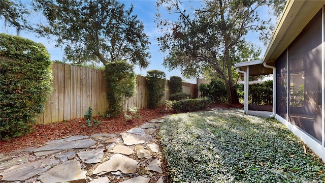 view of yard with a patio area and a sunroom