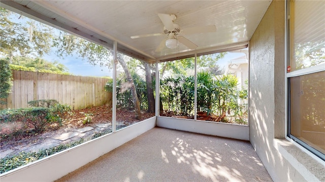 sunroom featuring ceiling fan