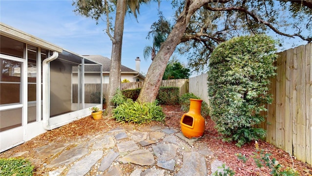 view of patio / terrace featuring a sunroom