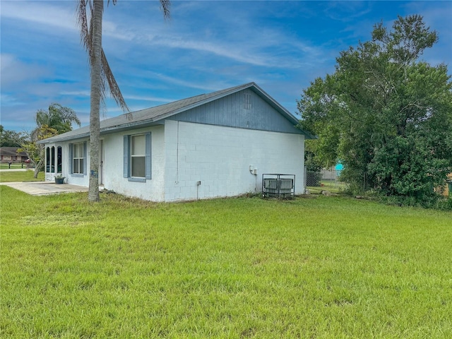 view of property exterior with a yard