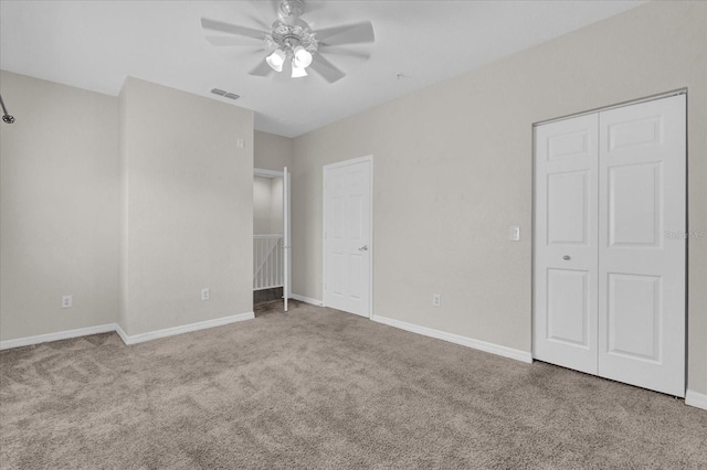 unfurnished bedroom with visible vents, ceiling fan, baseboards, and carpet floors