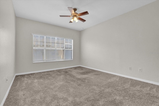 empty room featuring carpet and ceiling fan