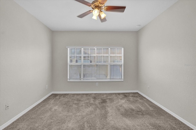 carpeted empty room with ceiling fan