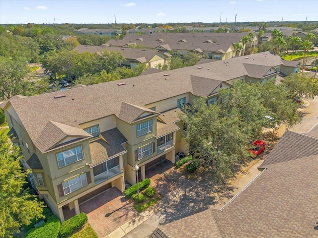 birds eye view of property with a residential view