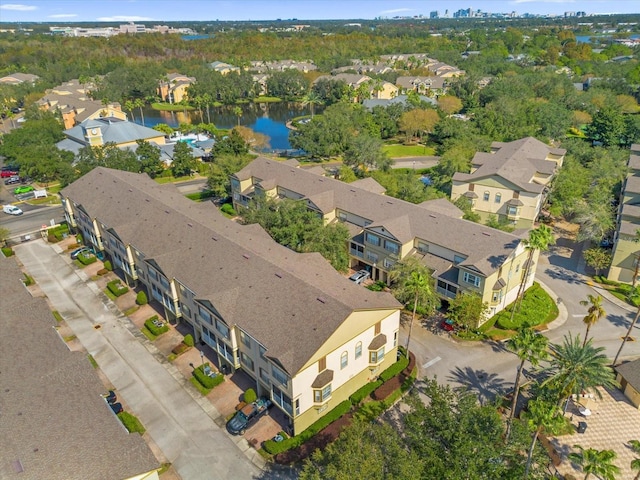 birds eye view of property with a residential view and a water view
