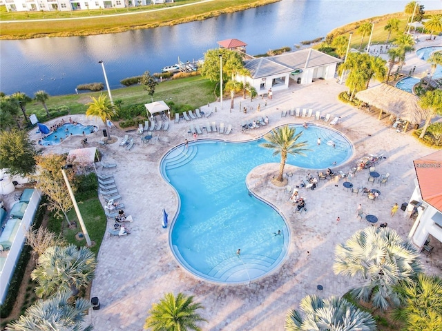 view of pool featuring a water view