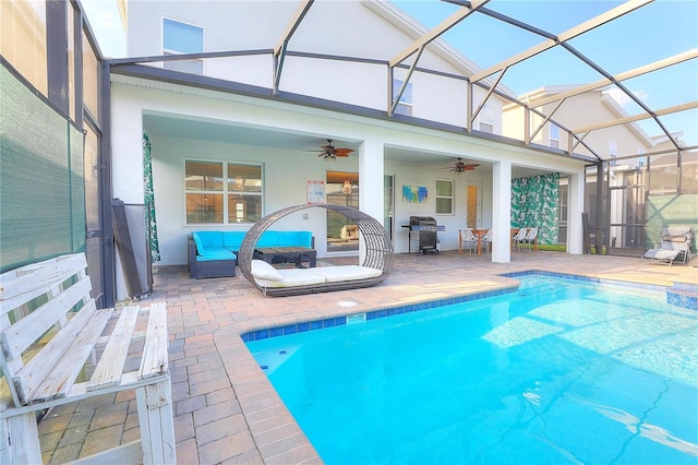 view of swimming pool with a patio, ceiling fan, and a lanai