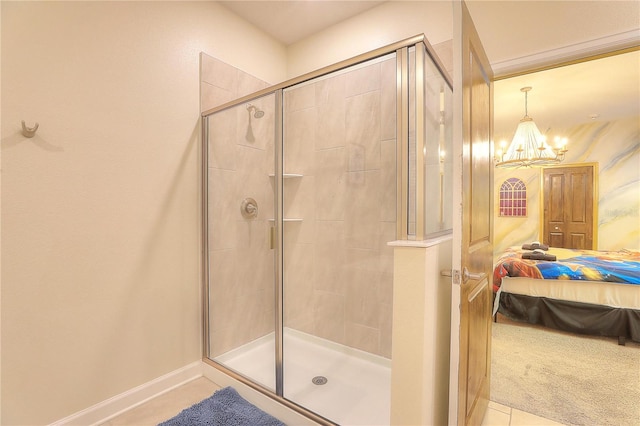 bathroom with tile patterned flooring, a chandelier, and walk in shower