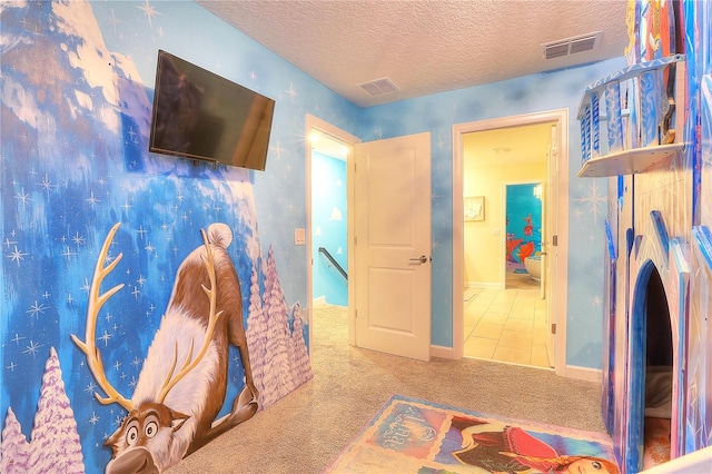 bedroom featuring a textured ceiling and carpet floors