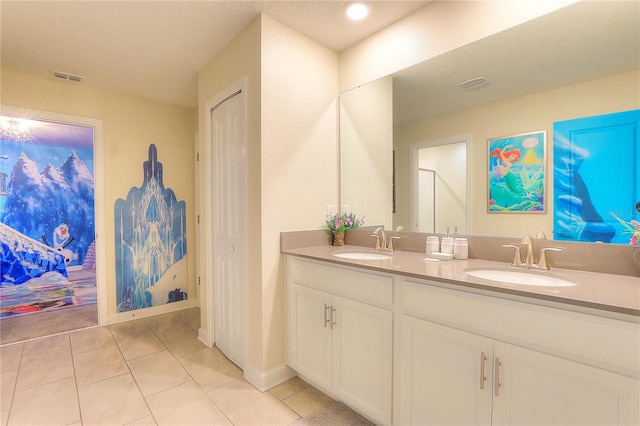 bathroom featuring tile patterned flooring and vanity