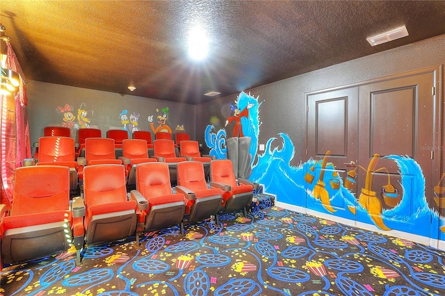 home theater room featuring a textured ceiling