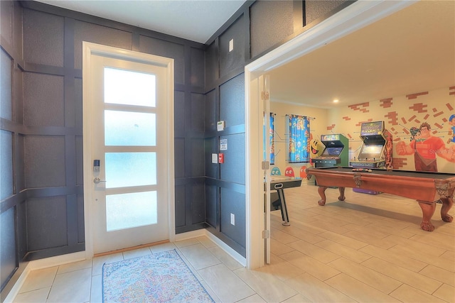 foyer with light tile patterned floors and pool table