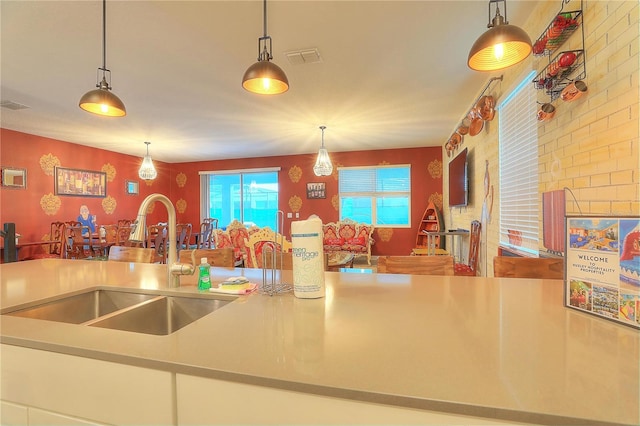 kitchen featuring sink and decorative light fixtures