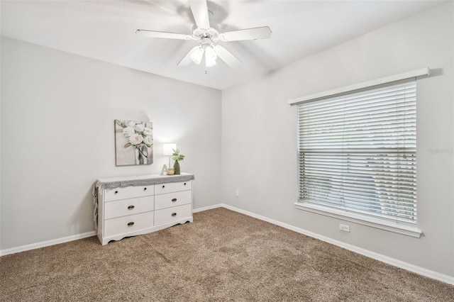 unfurnished bedroom featuring ceiling fan and carpet floors