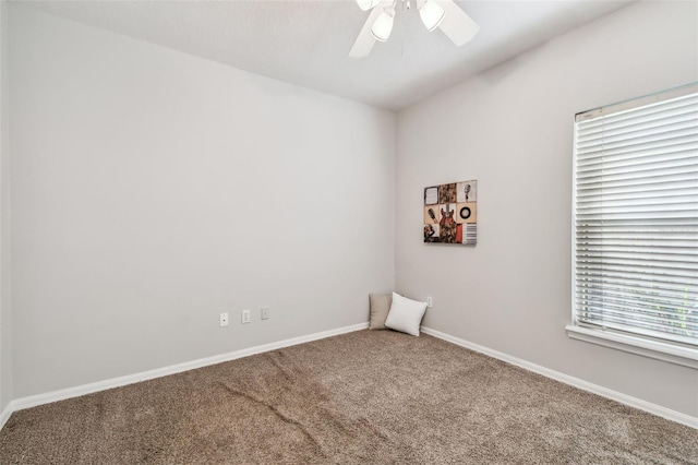 empty room with carpet floors and ceiling fan