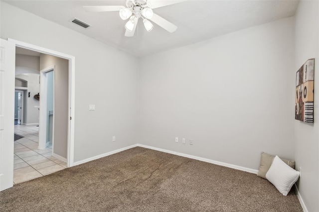 carpeted empty room with ceiling fan