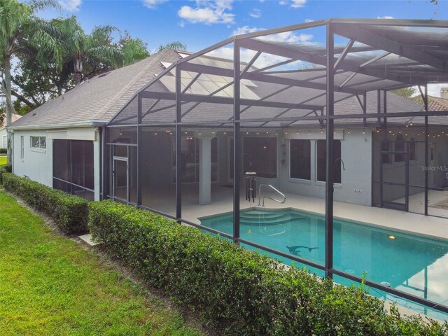 view of pool featuring a patio and a lanai