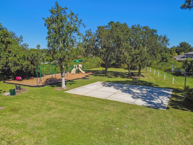 surrounding community featuring a playground and a yard