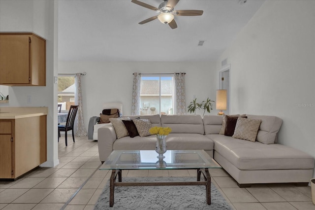 living room featuring ceiling fan and light tile patterned floors