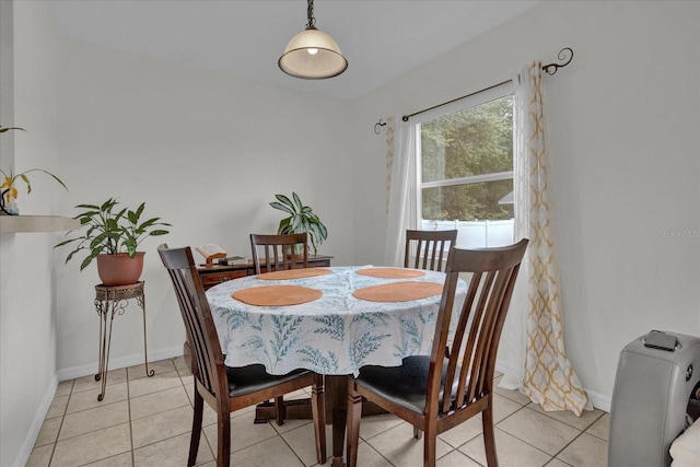 dining area with light tile patterned floors